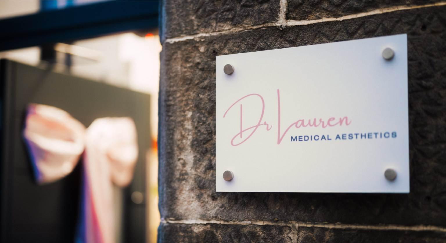 A sign saying "Dr Lauren MEDICAL AESTHETICS" at the entrance of Dr Lauren's clinic in Haddow Street, Hamilton.