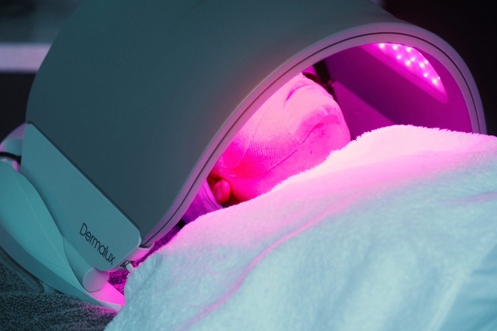 A patient getting a Dermalux LED light treatment.