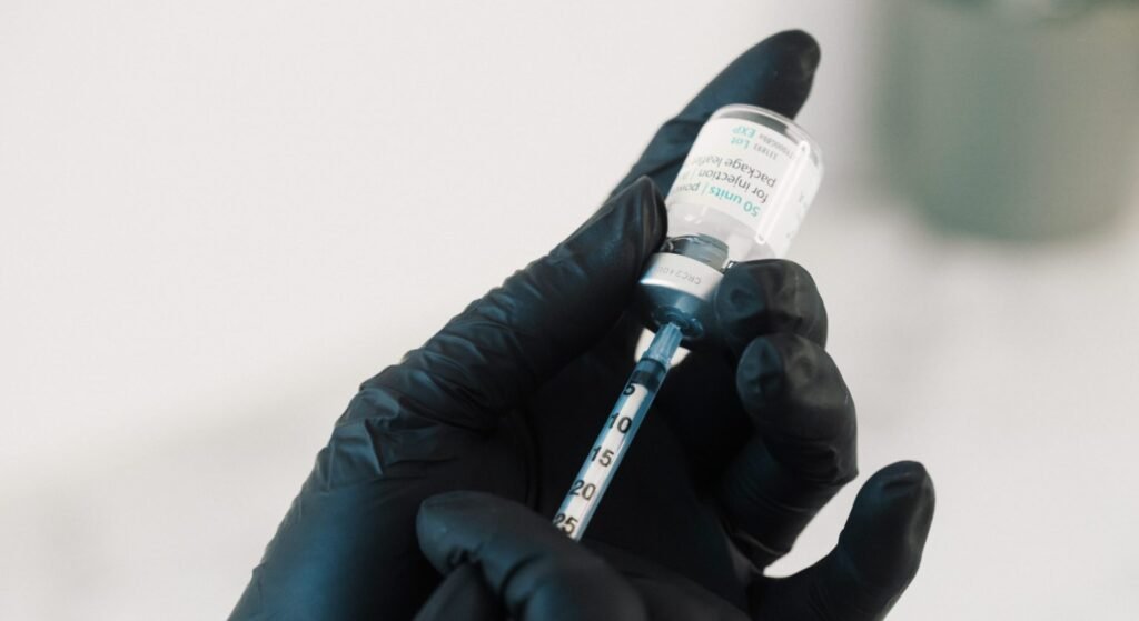 Dr. Lauren prepping a syringe with Botulinum toxin to be used on a patient.