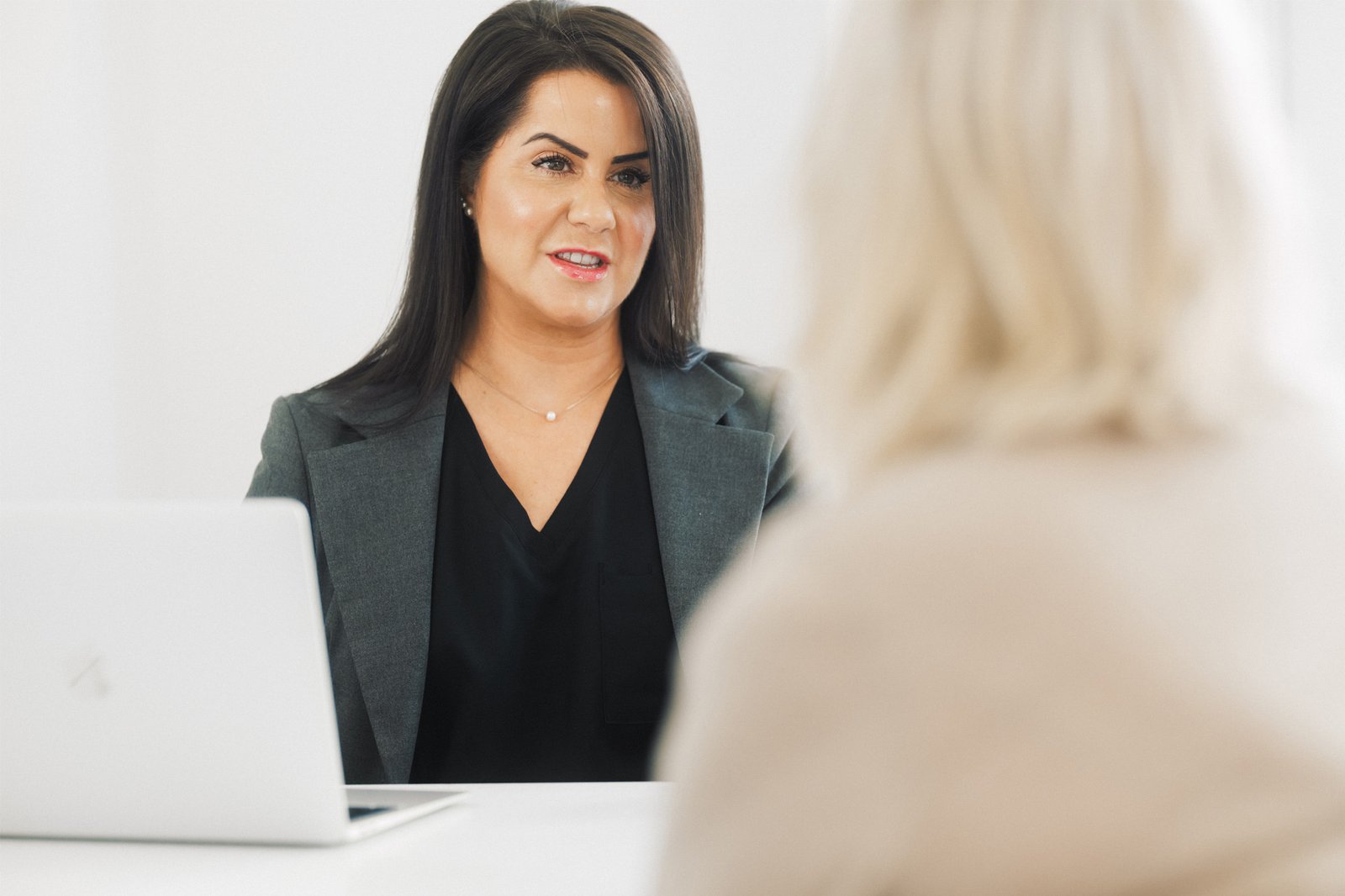 Dr. Lauren consulting with a patient as to which aesthetic treatment will be the most beneficial for her.