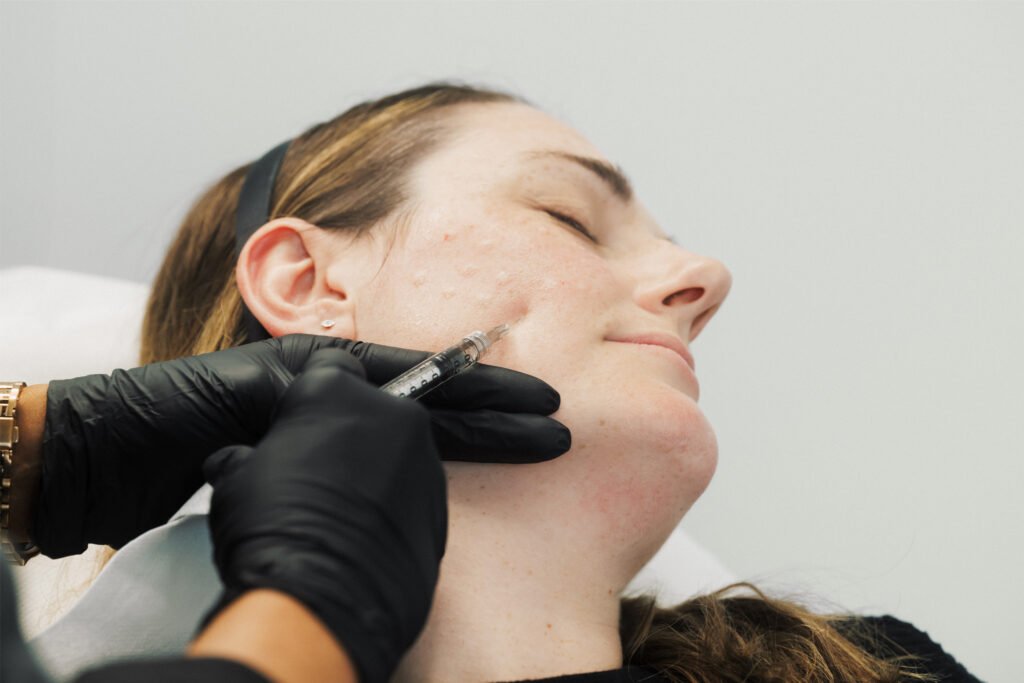 Dr Lauren injecting a patient's face