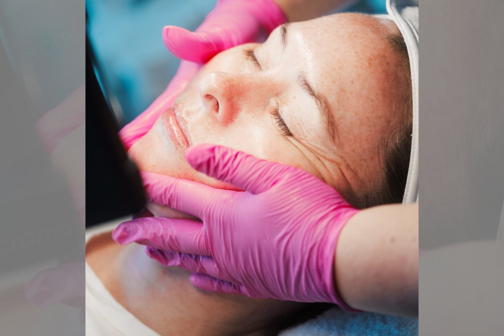 Dr Lauren's Skin Therapist massaging a patient's face as part of Hydrafacial.