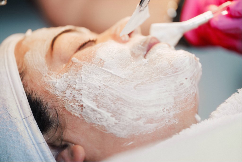 A patient receiving a facial at Dr Lauren's medical aesthetic clinic.