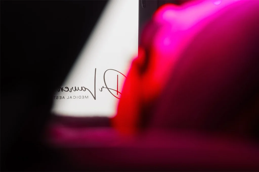 A patient getting LED light treatment at Dr Lauren's clinic in Hamilton.