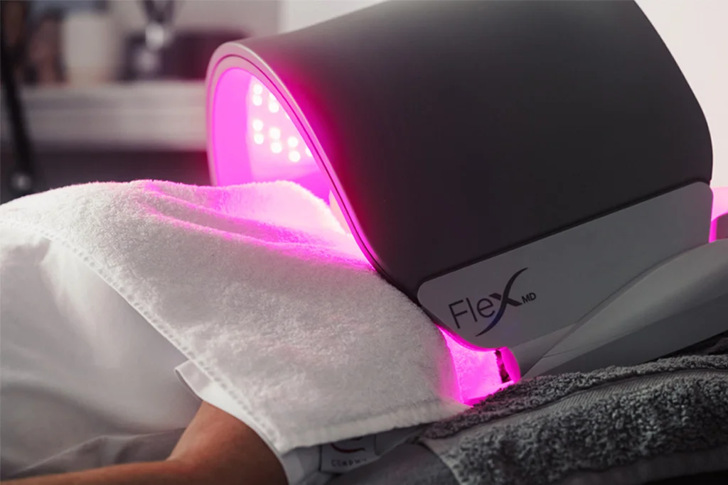 A patient under the LED light treatment at Dr Lauren's medical aesthetic clinic in Hamilton.