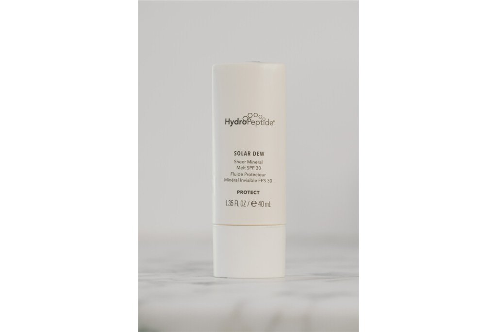 A bottle of HydroPeptide's "Solar Dew" SPF.