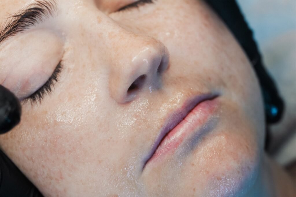A patient getting a facial from one of the Skin Therapists at Dr Lauren's clinic.