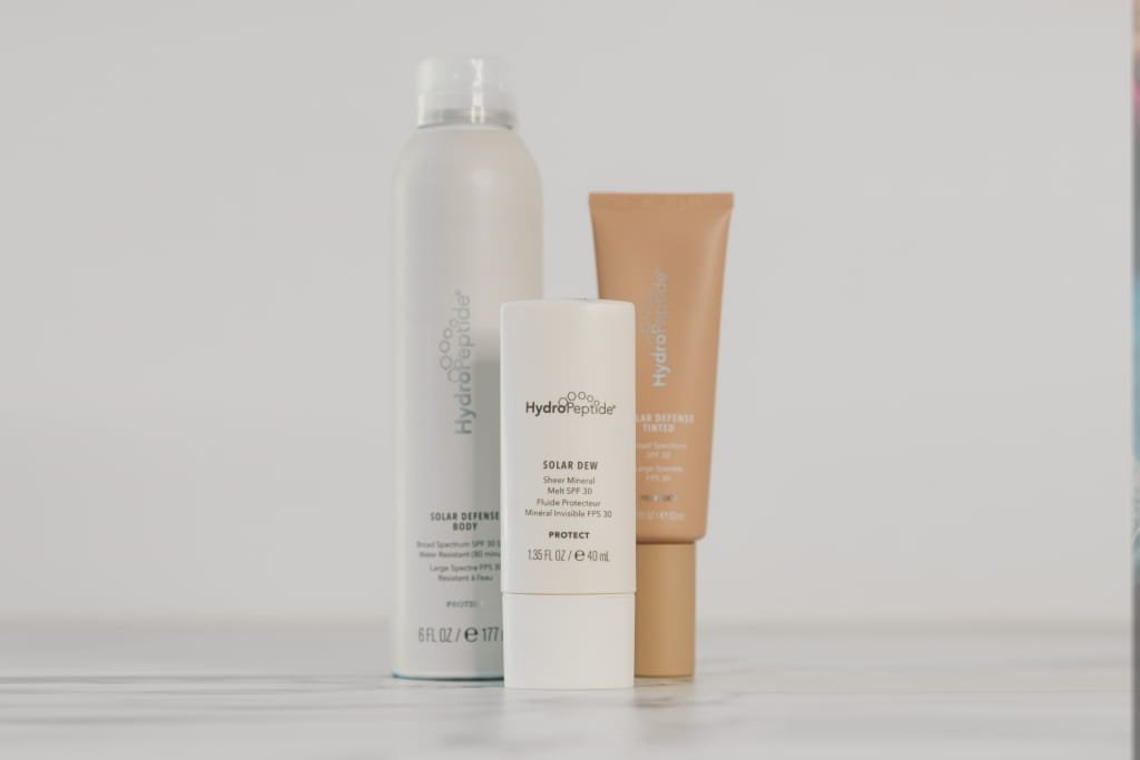 Three HydroPeptide products, including Solar Dew SPF.