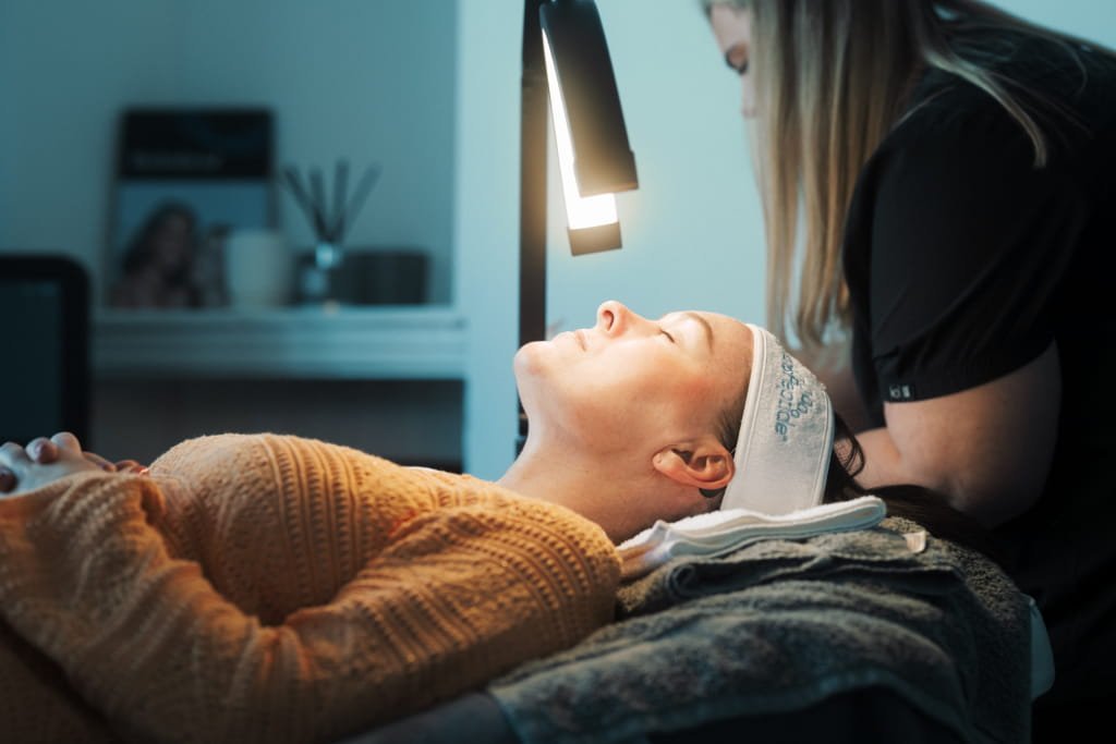 A patient getting a HydroPeptide facial from one of the Skin Therapists at Dr Lauren's clinic.