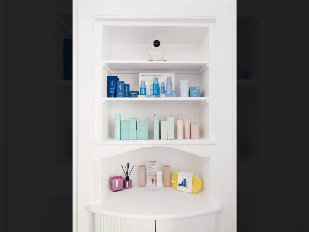 A shelving unit displaying a range of HydroPeptide products.