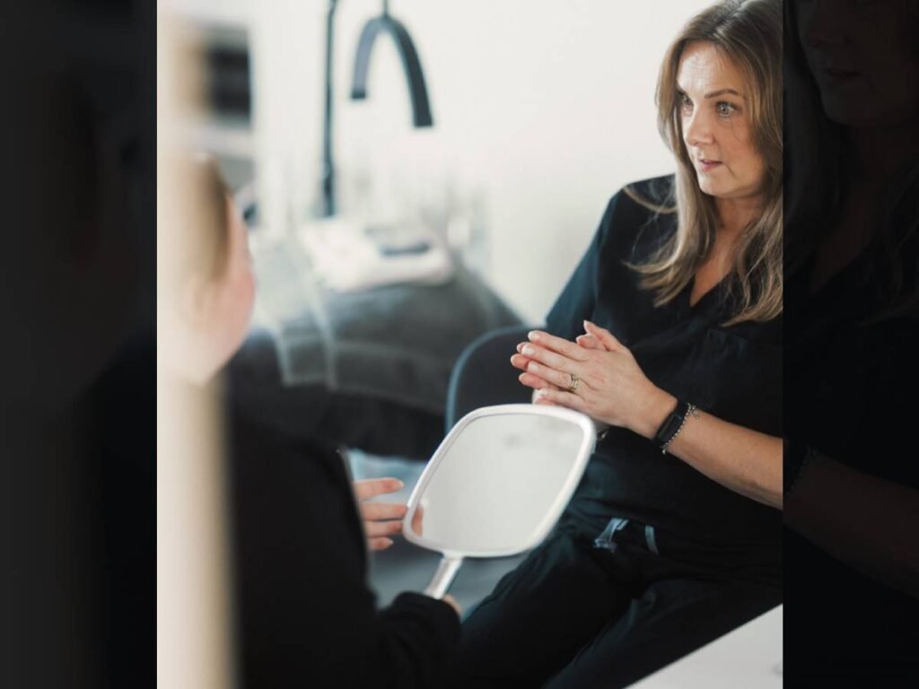 A Skin Therapist at Dr Lauren's clinic delivering a consultation.