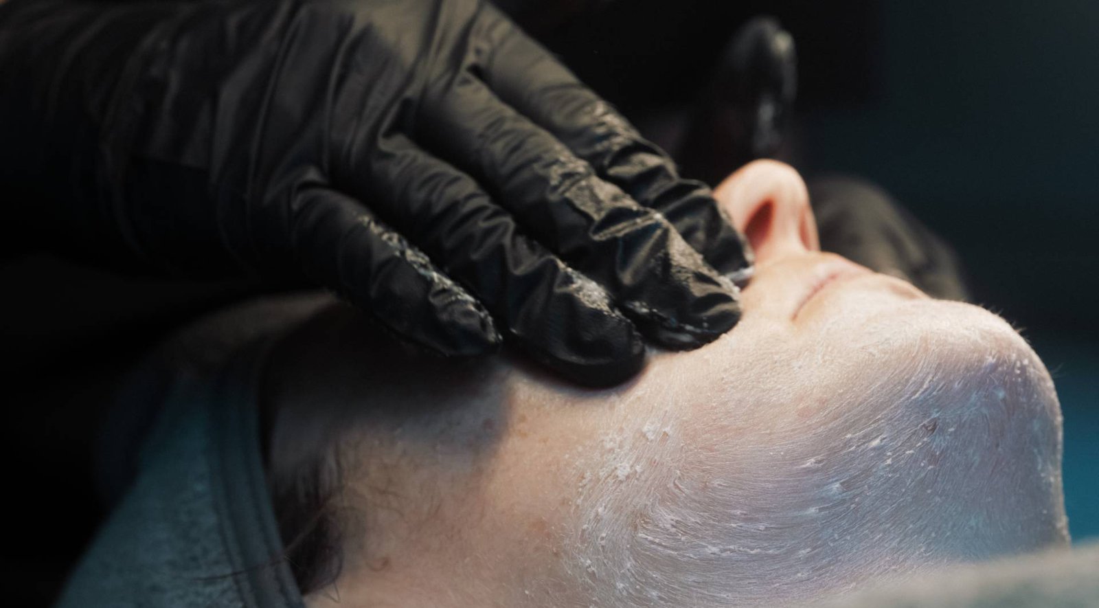 A Skin Therapist at Dr Lauren's clinic giving a facial to a patient.